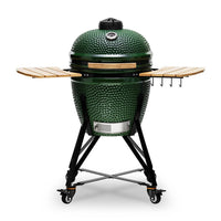 Green ceramic grill with wooden shelves on a white background