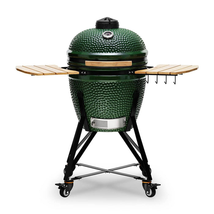 Green ceramic grill with wooden shelves on a white background