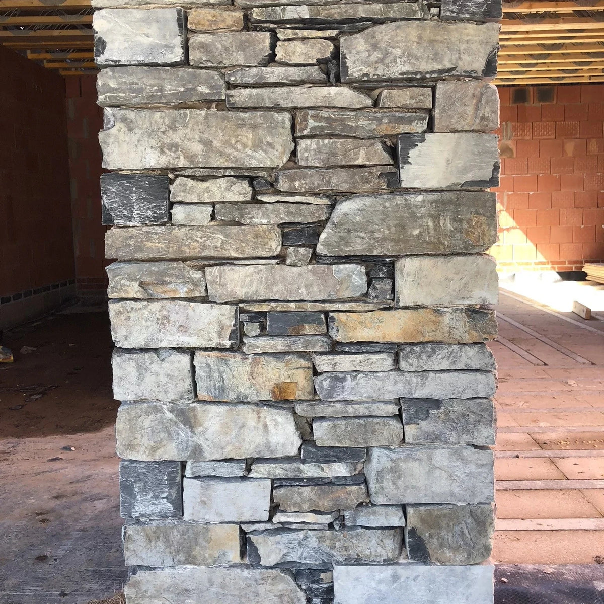 Stone column with natural stone texture in an outdoor setting