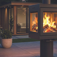 Outdoor patio scene with a fire pit and seating area at night.