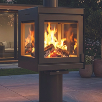 Outdoor fireplace with flames burning inside, set against a patio and garden background.