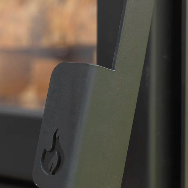 Close-up of a door handle on a glass door with a blurred background