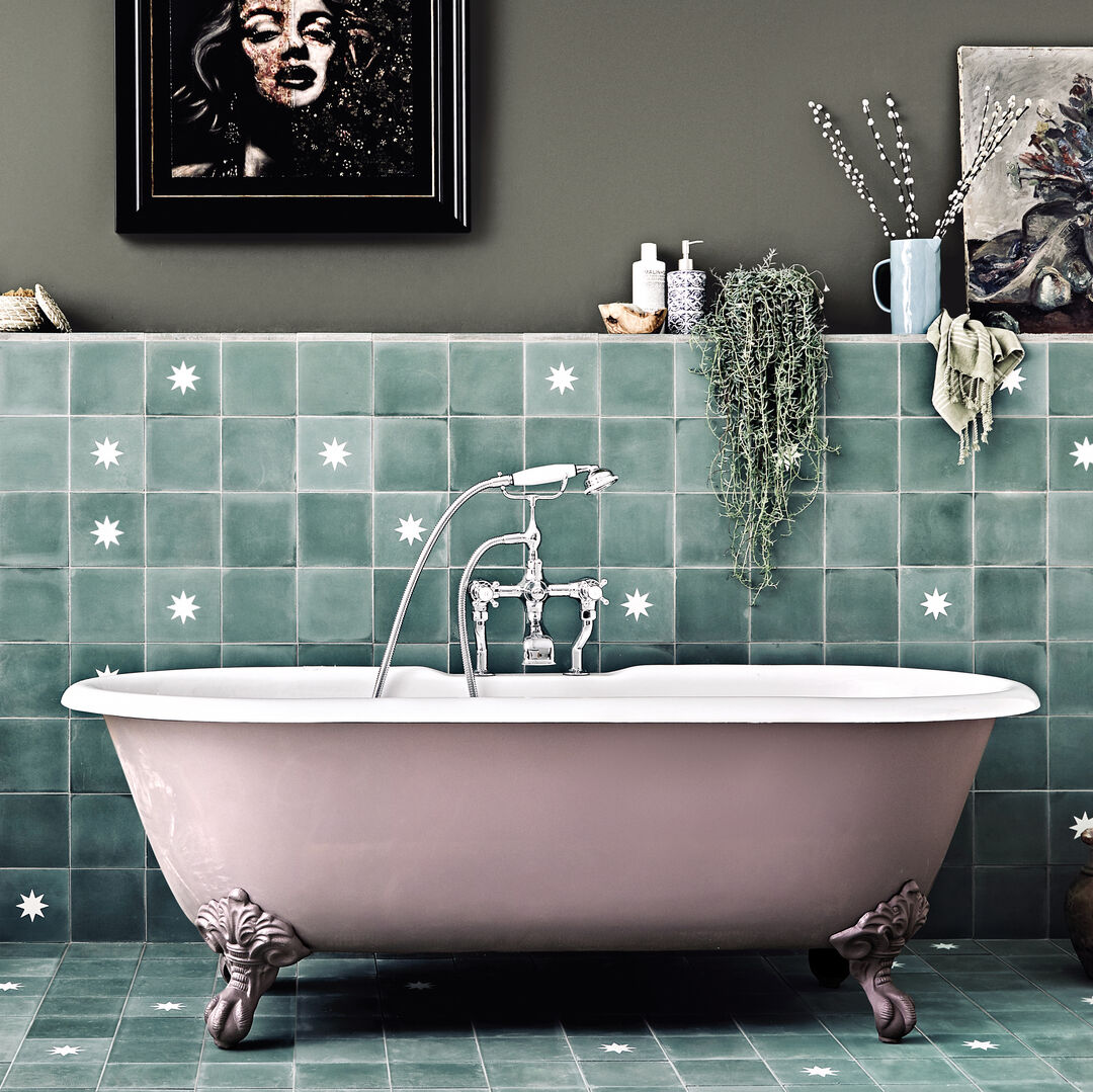 Fired Earth freestanding bath with green patterned tiles